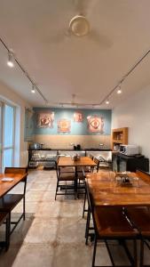 a room with tables and chairs in a kitchen at The Jais Boutique Stay in Varanasi