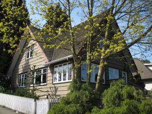 a house with a black roof at Point Grey Guest House in Vancouver