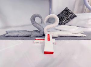 Ein Bett oder Betten in einem Zimmer der Unterkunft SNOW Studio Apartment - Near Clark International Airport