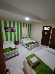 Ein Bett oder Betten in einem Zimmer der Unterkunft Hotel El Andino
