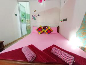 Postel nebo postele na pokoji v ubytování Pearl Deluna Resort Mirissa