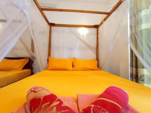 Postel nebo postele na pokoji v ubytování Pearl Deluna Resort Mirissa