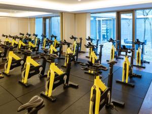 a gym with rows of exercise bikes in a building at The Europe Hotel & Resort in Killarney