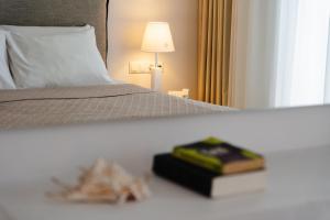 Voodi või voodid majutusasutuse Mitos Suites toas