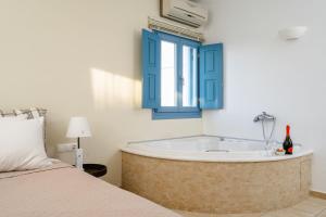 Voodi või voodid majutusasutuse Mitos Suites toas