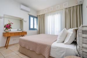 Postel nebo postele na pokoji v ubytování Mitos Suites + 37 fotografií