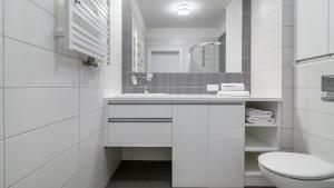 Koupelna v ubytování Przytulny apartament na zamkniętym osiedlu + 11 fotografií