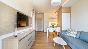 TV a/nebo společenská místnost v ubytování Przytulny apartament na zamkniętym osiedlu