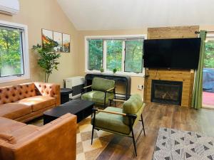 a living room with a couch and a fireplace at Comfortable Cozy Conway Hideaway that Sleeps 8 Pet Friendly in Conway