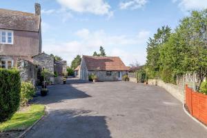 an empty driveway in front of a house at Cottage in North Somerset in Clevedon