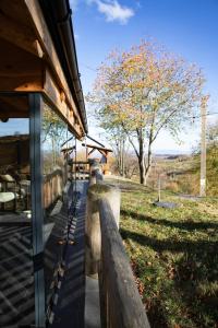a wooden fence in front of a house at Casa de pe deal Sinteu in Şinteu