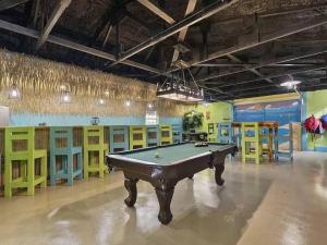 a pool table in a room with yellow and blue at Family fun on the lake! in Reeds Spring