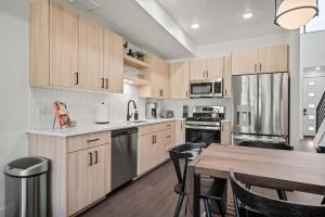 a kitchen with wooden cabinets and a wooden table at Alpine Adventure Pt C201 Wolf Creek Golf Course in Mountain View Estates