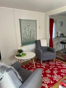 a living room with two chairs and a table at Aurora Center 3 in Rovaniemi