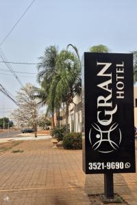 a sign for a store on a street at GRAN HOTEL in Três Lagoas