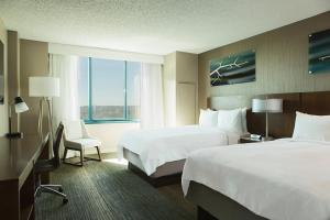 a hotel room with two beds and a window at Falls Church Marriott Fairview Park in Falls Church +63 photos