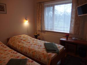 Postel nebo postele na pokoji v ubytování Parks Guest House
