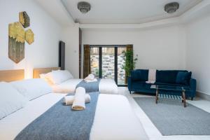 Ένα ή περισσότερα κρεβάτια σε δωμάτιο στο Finchley Road Studios & Apartments by PrimeCityHosts