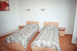 Postel nebo postele na pokoji v ubytování Pensiunea Belvedere