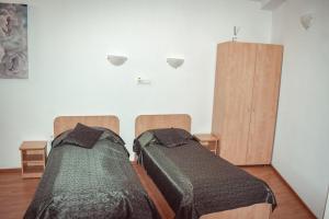 Postel nebo postele na pokoji v ubytování Pensiunea Belvedere
