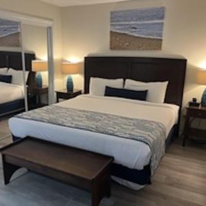 a bedroom with a large bed in a room at Summer Sands - 303 by Sea Scape Properties in Wrightsville Beach