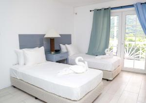 Posteľ alebo postele v izbe v ubytovaní Sugarmon Villas