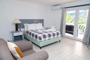 Posteľ alebo postele v izbe v ubytovaní Sugarmon Villas