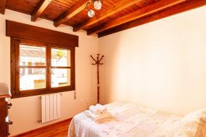 Postel nebo postele na pokoji v ubytování Casa Rural La Regoria