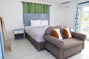 Posteľ alebo postele v izbe v ubytovaní Sugarmon Villas