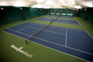 an indoor tennis court with two tennis courts at Three Ridges 74 with Wintergreen Advantage in Wintergreen +7 photos