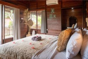 Postel nebo postele na pokoji v ubytování Mad Monkey Nusa Lembongan