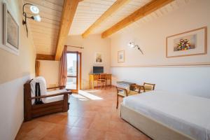 Кровать или кровати в номере Lola Piccolo Hotel e Appartamenti