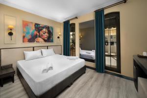 a bedroom with a large white bed in a room at Onyour Dreams Belek in Belek +26 photos