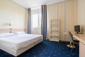 Postel nebo postele na pokoji v ubytování Hotel Torre Di Pratolungo + 37 fotografií