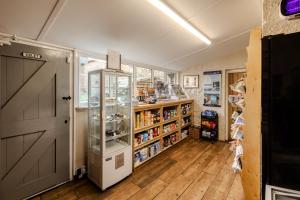 a room with a door and a book shelf at Star Cottage - Harbottle - Nr Rothbury - Northumberland in Morpeth
