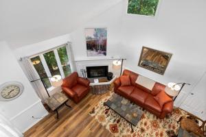 a living room with a couch and a fireplace at Laurelwood 25 with Wintergreen Advantage in Wintergreen