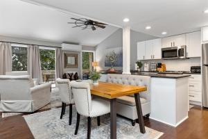 a kitchen and living room with a wooden table and chairs at White Oak 51 with Wintergreen Advantage in Wintergreen