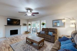 a living room with a couch and a fireplace at Gold Country Getaway in Jamestown