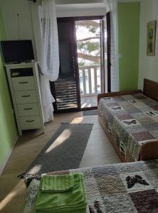 Posteľ alebo postele v izbe v ubytovaní Apartments Ani