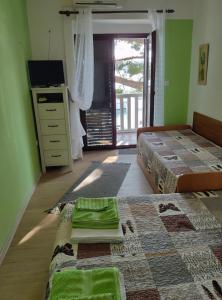 Posteľ alebo postele v izbe v ubytovaní Apartments Ani