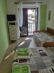 Posteľ alebo postele v izbe v ubytovaní Apartments Ani