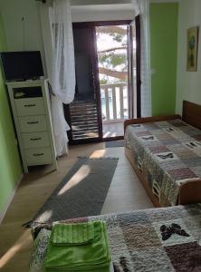 Posteľ alebo postele v izbe v ubytovaní Apartments Ani