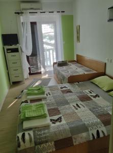 Posteľ alebo postele v izbe v ubytovaní Apartments Ani