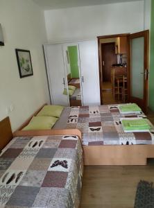 Posteľ alebo postele v izbe v ubytovaní Apartments Ani