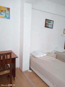 Postel nebo postele na pokoji v ubytování HZD Apartments Hostel