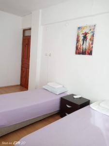 Postel nebo postele na pokoji v ubytování HZD Apartments Hostel