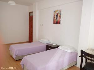Postel nebo postele na pokoji v ubytování HZD Apartments Hostel