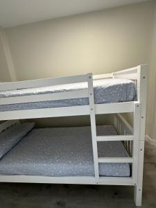 two bunk beds in a small room at Malteses in A Guarda