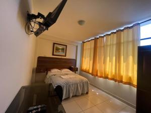 Postel nebo postele na pokoji v ubytování Tallan Hotel
