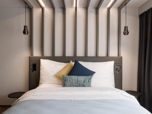 Postel nebo postele na pokoji v ubytování Park Hotel Zug